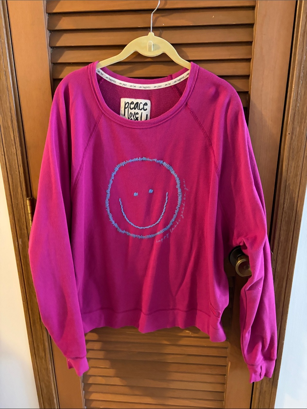 Peace Love World Fuchsia Pullover with Light Blue Smiley